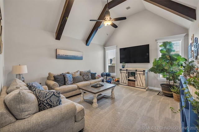 carpeted living room featuring beamed ceiling, high vaulted ceiling, ceiling fan, and a healthy amount of sunlight