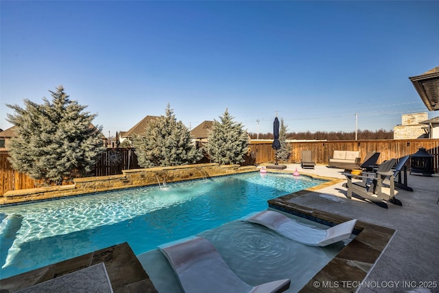 view of swimming pool with a patio area and pool water feature