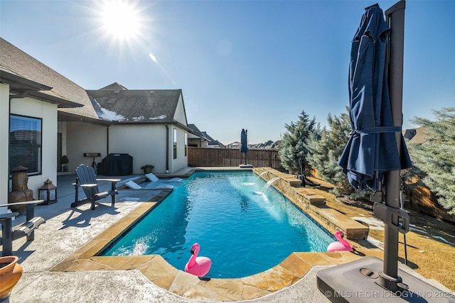 view of swimming pool featuring pool water feature and a patio area