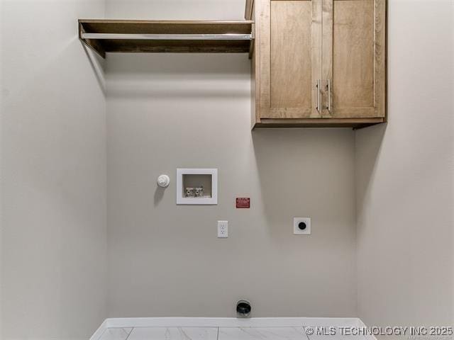 laundry room with washer hookup, cabinets, hookup for an electric dryer, and gas dryer hookup