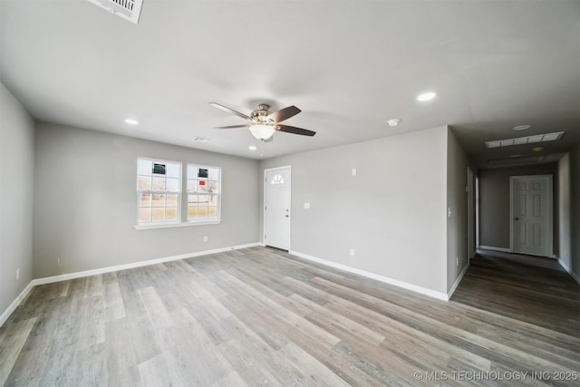 unfurnished room featuring light wood-type flooring and ceiling fan