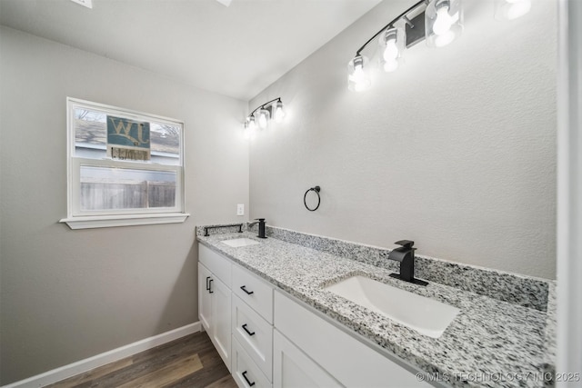 bathroom featuring vanity and hardwood / wood-style flooring