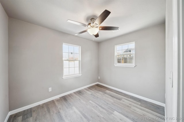 unfurnished room featuring ceiling fan, a healthy amount of sunlight, and light hardwood / wood-style flooring