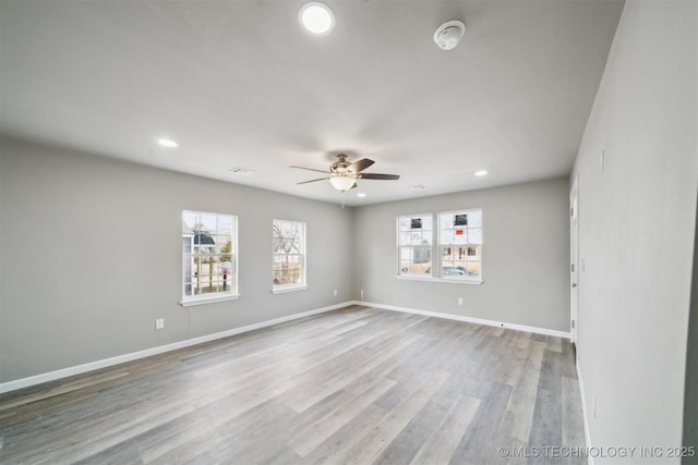 unfurnished room featuring light wood-type flooring and ceiling fan