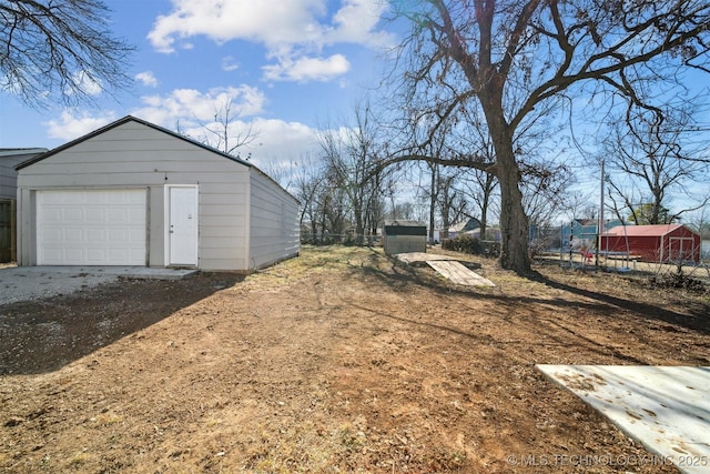 exterior space featuring an outbuilding and a detached garage