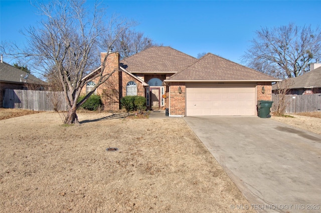 ranch-style home featuring a garage