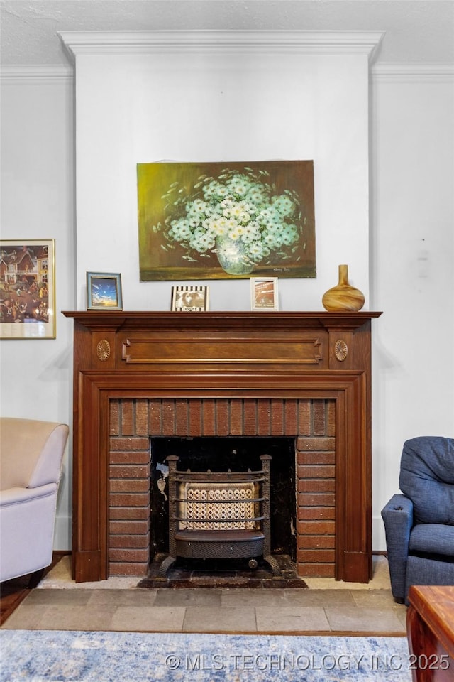 room details featuring crown molding and a fireplace