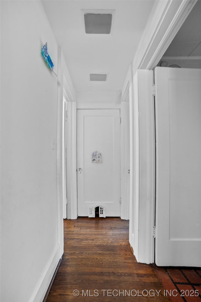 hallway featuring dark hardwood / wood-style floors