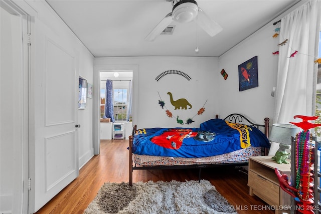 bedroom featuring ceiling fan and wood-type flooring