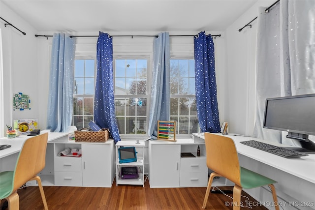 home office with hardwood / wood-style floors