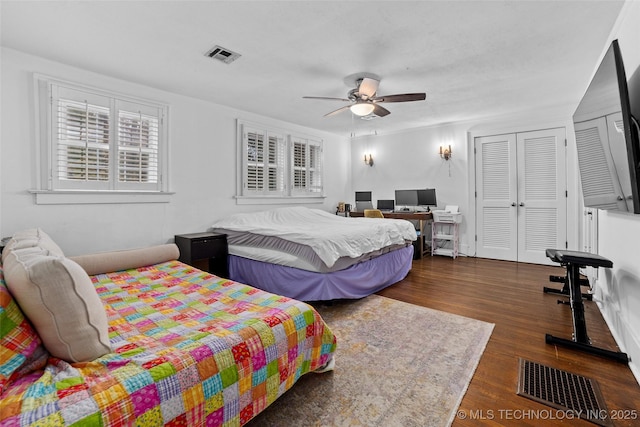 bedroom featuring ceiling fan and dark wood-type flooring