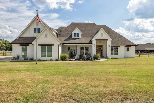 modern inspired farmhouse featuring a front yard