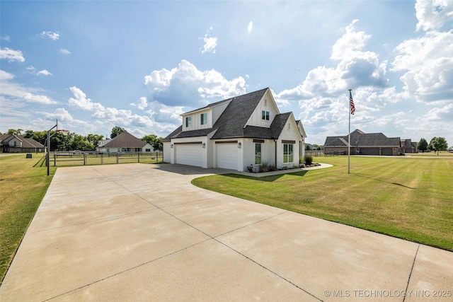 view of home's exterior with a garage and a lawn