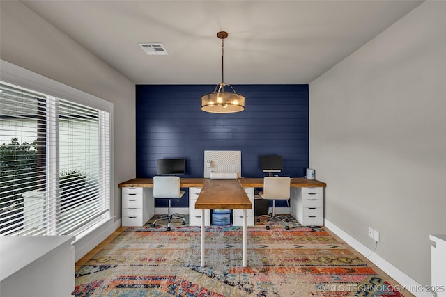 home office featuring wooden walls