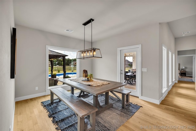 dining area featuring light hardwood / wood-style floors and a healthy amount of sunlight