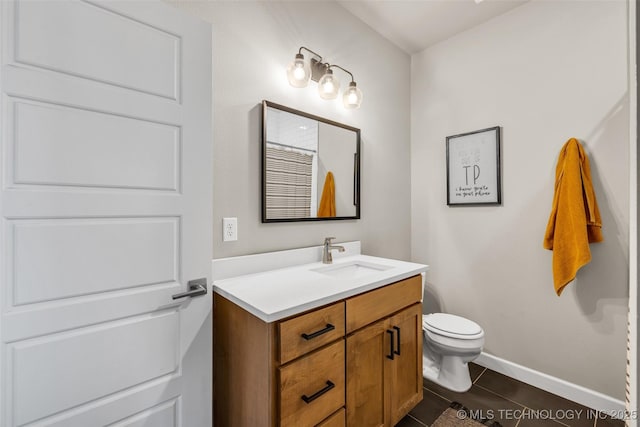 bathroom featuring toilet and vanity