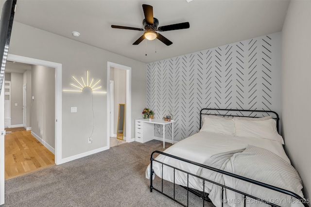 bedroom with ceiling fan and carpet flooring