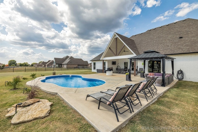 view of swimming pool featuring a gazebo, an outdoor hangout area, a patio area, and a yard