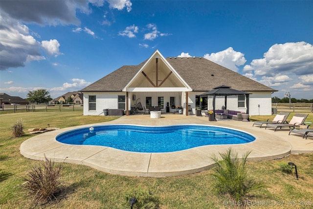 view of swimming pool with a gazebo, a yard, outdoor lounge area, and a patio