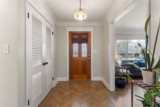 foyer entrance with an inviting chandelier, crown molding, and parquet floors