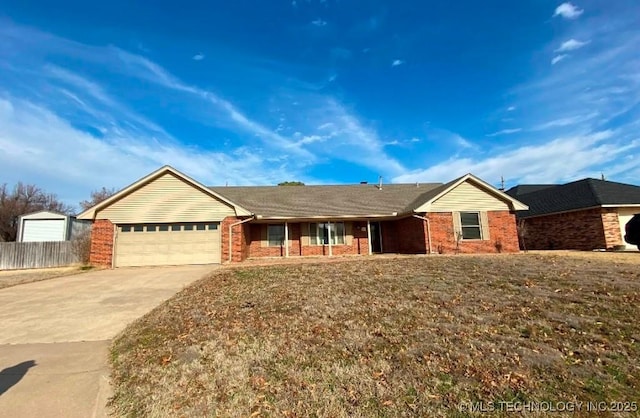 ranch-style house featuring a front lawn and a garage