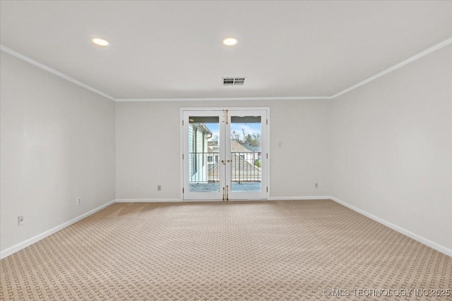 empty room with french doors, visible vents, light carpet, and baseboards