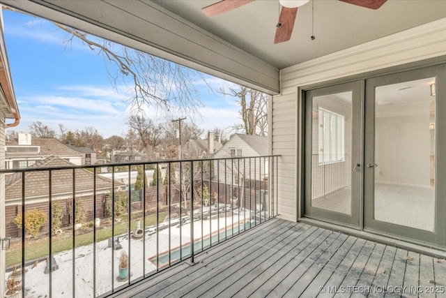 balcony with ceiling fan and french doors