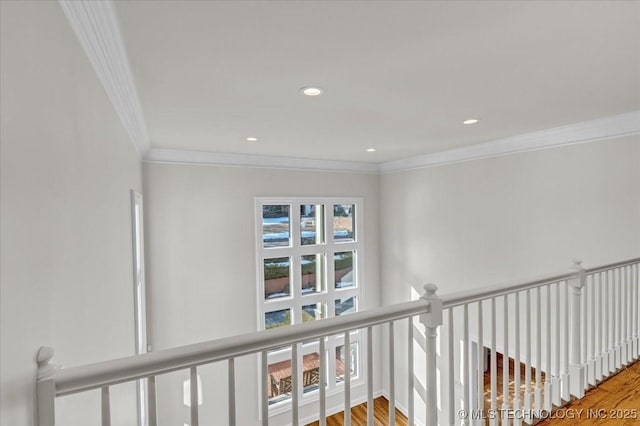 hall featuring ornamental molding, recessed lighting, and wood finished floors