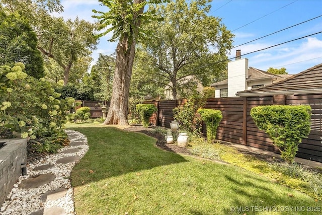 view of yard featuring a fenced backyard