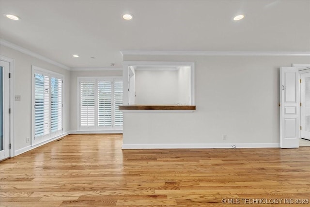 interior space with light wood-style flooring, ornamental molding, baseboards, and recessed lighting