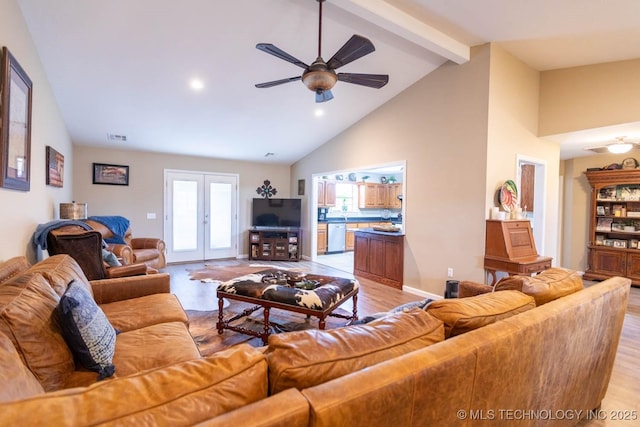 living room featuring beamed ceiling, french doors, light hardwood / wood-style floors, high vaulted ceiling, and ceiling fan