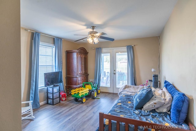 bedroom with ceiling fan, french doors, access to outside, and hardwood / wood-style flooring