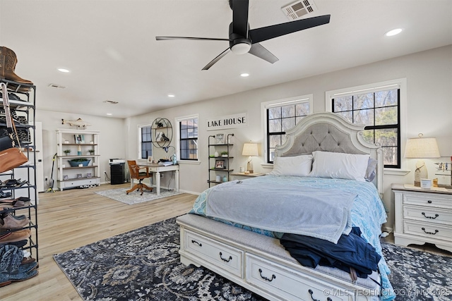 bedroom featuring ceiling fan and light hardwood / wood-style floors