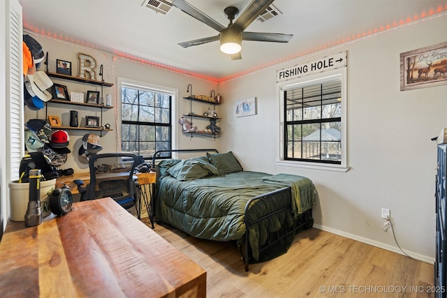 bedroom with ceiling fan and light wood-type flooring