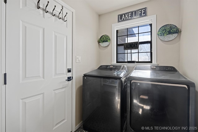 washroom with washer and dryer