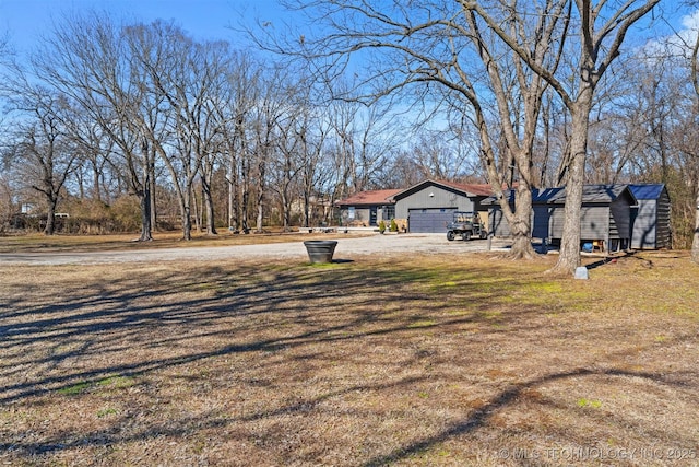 view of yard featuring a garage