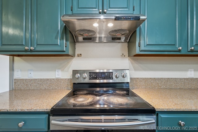 kitchen featuring under cabinet range hood, stainless steel electric range oven, blue cabinets, and light countertops