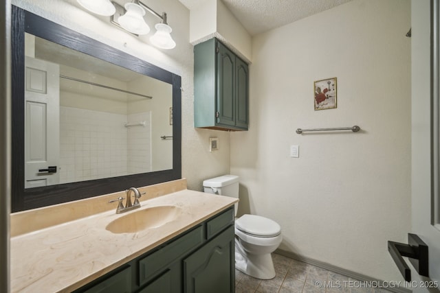 bathroom with toilet, vanity, tile patterned floors, a textured ceiling, and a shower