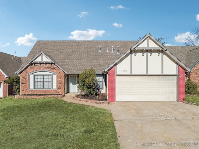 view of front of property featuring a garage and a front lawn