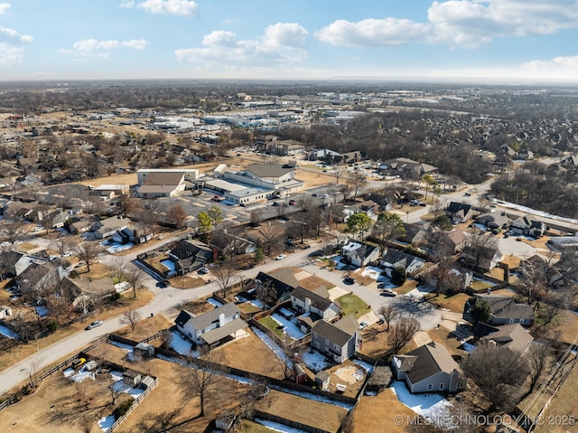 birds eye view of property with a residential view