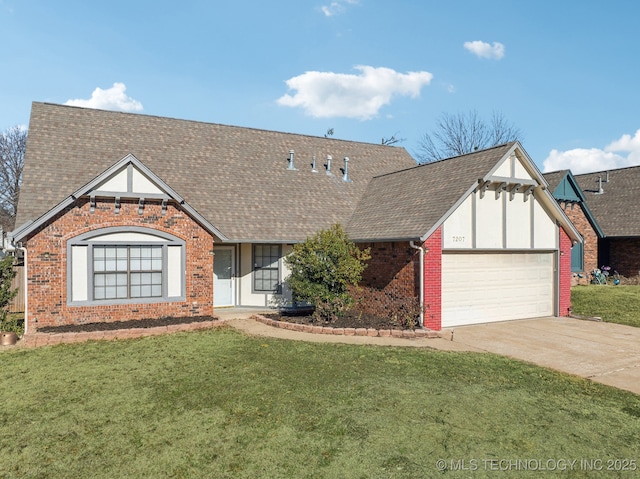 english style home featuring driveway, a front yard, a shingled roof, a garage, and brick siding