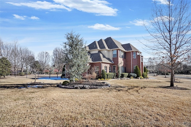 view of property exterior with a lawn