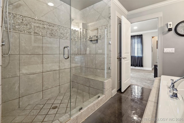 bathroom featuring a shower with shower door and ornamental molding