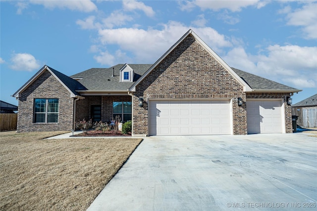 view of front of home featuring a garage and a front lawn