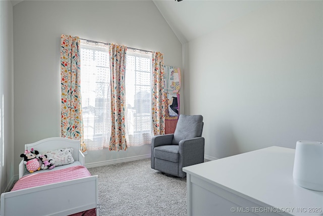 carpeted bedroom with lofted ceiling