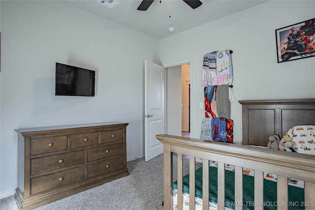 bedroom with ceiling fan and light colored carpet