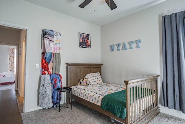 bedroom with ceiling fan and carpet floors