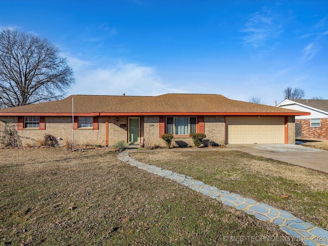 ranch-style home with a garage and a front lawn