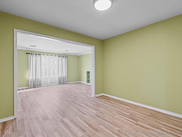 unfurnished room featuring light wood-type flooring