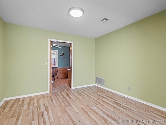 spare room with light hardwood / wood-style floors